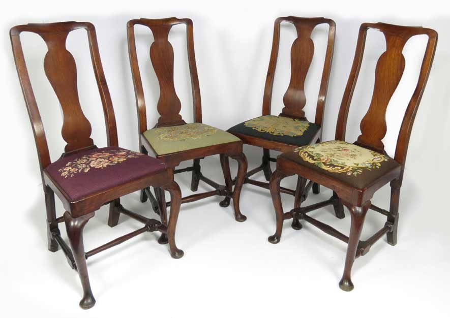 SET OF (4) QUEEN ANNE WALNUT SIDECHAIRS: 18th c., needlepoint slip seats, block and turned stretchers, 40.5”h; 18”w From a Little Compton, RI estate.