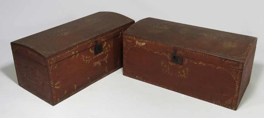 PAIR OF NEW ENGLAND PAINTED DOME-TOP TRUNKS: 19th c., old red with painted white floral border and elements, 14.5”h; 32.5”w; 15.5”d