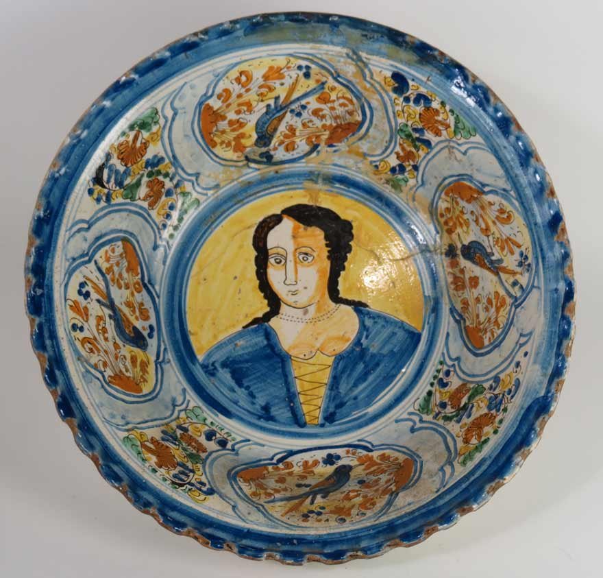 CONTINENTAL FAIENCE FOOTED BOWL: 17th c., polychrome decoration with center portrait, 4.75”h; 12.25”diam.