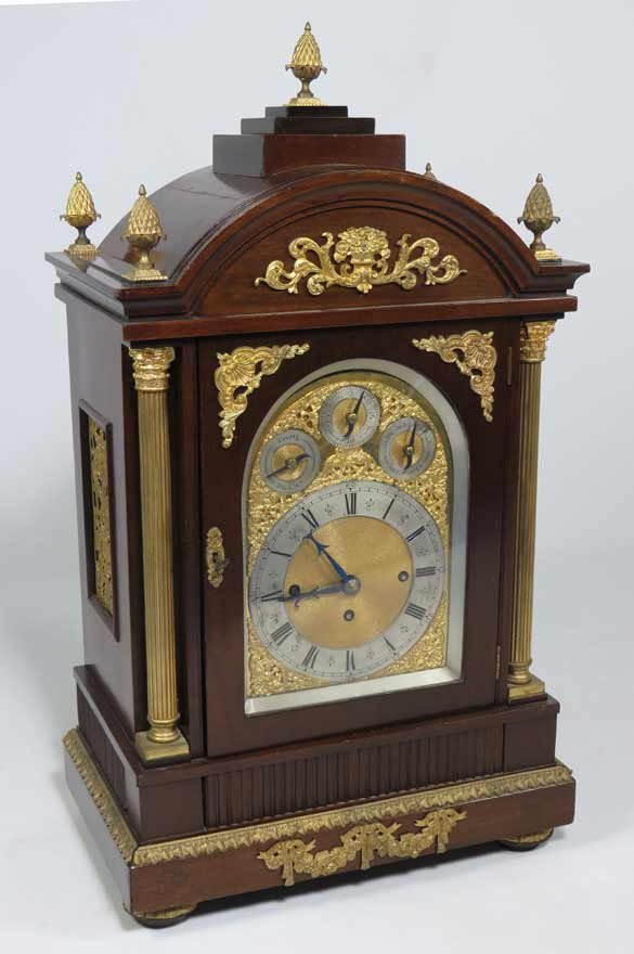 GEORGIAN-STYLE MAHOGANY-CASED BRACKET CLOCK: ormolu mounted, three train movement, time, strike and Westminster chimes, 30”h; base, 17”w; 10.5”d