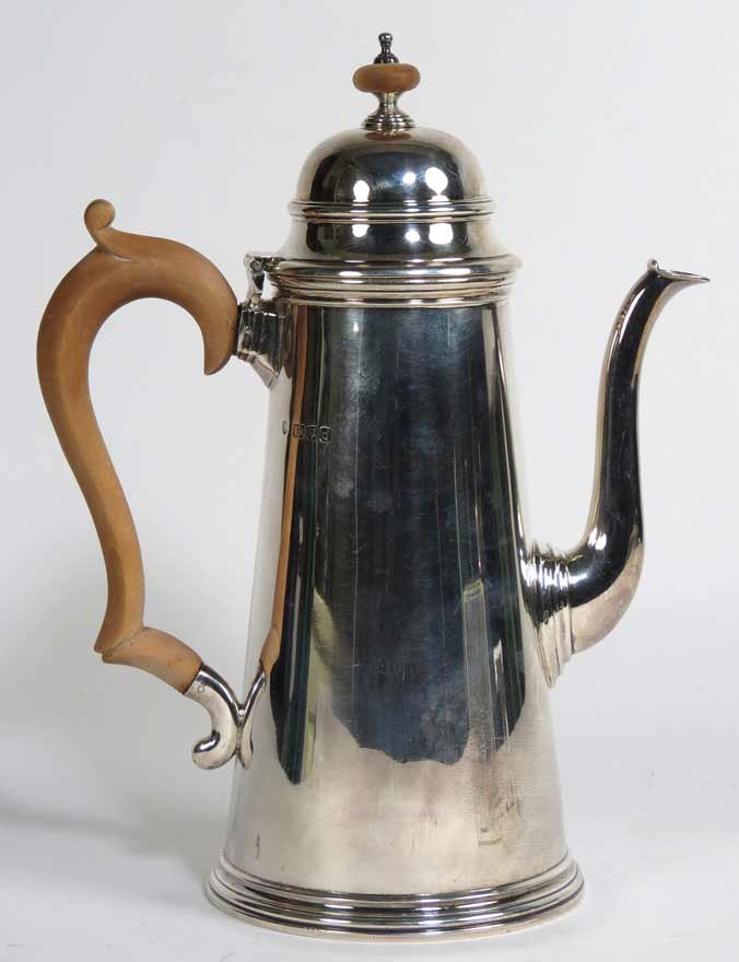 GEORGE I-STYLE SILVER COFFEE POT: lighthouse-form with goose-neck spout, James Robinson, London/NewYork, 1959 10”h; 28 troy oz. From a Chestnut St., Beacon Hill, Boston home.