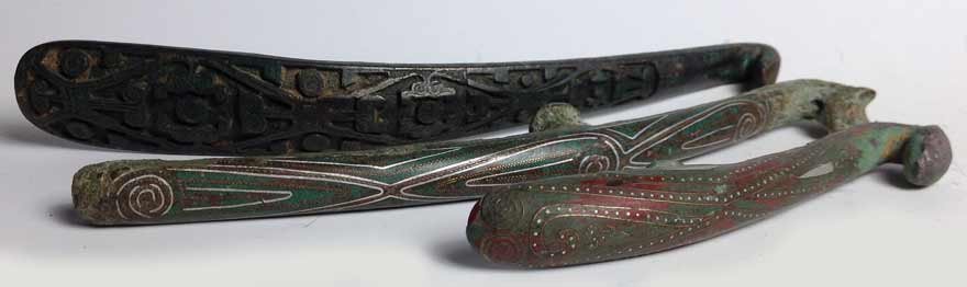 (3) BRONZE GARMENT HOOKS: Eastern Han, all with dragon head hooks, two inlaid with silver and green stone; the other with elaborate cut-work design, 7.5”; 7”; and 4.5” Prov.: The David Abbate (1949-2013) Collection