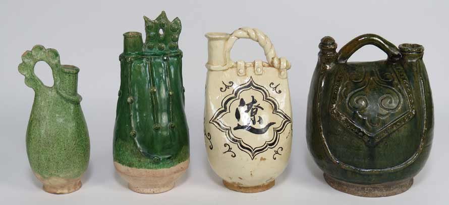 (4) GLAZED EARTHENWARE VESSELS: three with green glaze, 10.5”; 9”; and 10.5”; the fourth with cream glaze with black decoration, 9.5” Prov.: The David Abbate (1949-2013) Collection