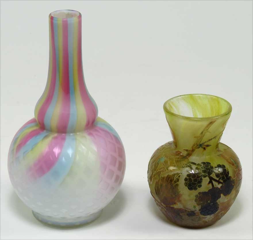 (on 2) SMALL ART GLASS MINIATURE VASES: one sgn. Daum Nancy, yellow glass with intaglio leaves and berries, 3.25”h; along with a gooseneck satin glass vase, quilted finish and carnival colored, 5.75”h From the inherited collection of a