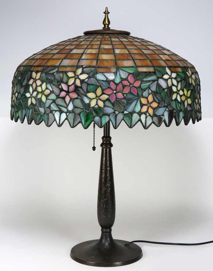 HANDEL LEADED GLASS TABLE LAMP: pink and white floral shade sgn. HANDEL, 18” diam. base signed in the casting HANDEL, 25.5” total h Ex. Kurt Reynolds collection, Boston Shade married to base. It is one recent opinion that the si