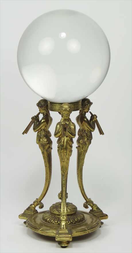 CRYSTAL GAZING ORB ON POMPEII-STYLE STAND: clear crystal ball on ormolu stand with three caryatids playing pipes, ball 6”diam; 15” total h Ex. Kurt Reynolds collection, Boston