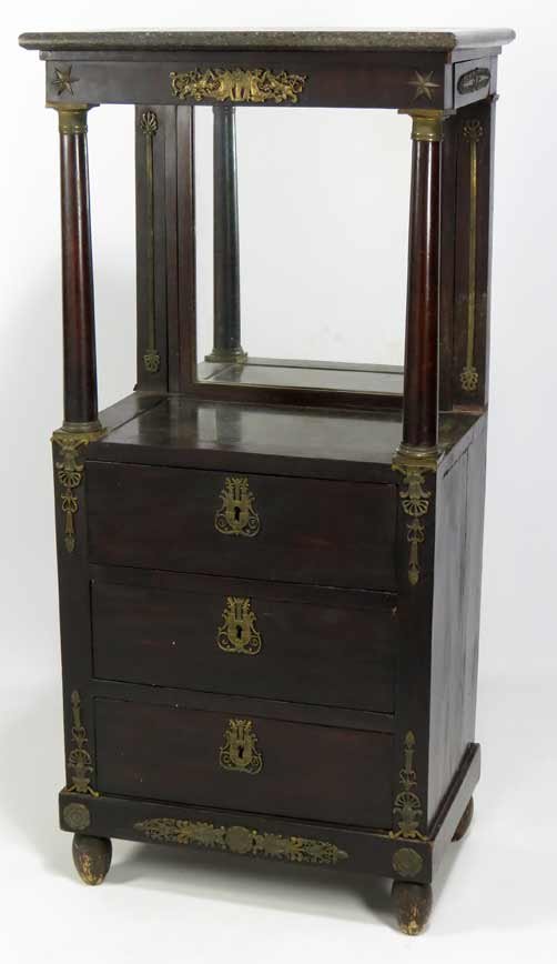 FRENCH EMPIRE MAHOGANY BACHELOR’S CABINET: narrow, marble top above open mirrored compartment, the mirror lifts up to eye level, above three drawers, good ormolu mounts, 45”h; 20”w; 13”d