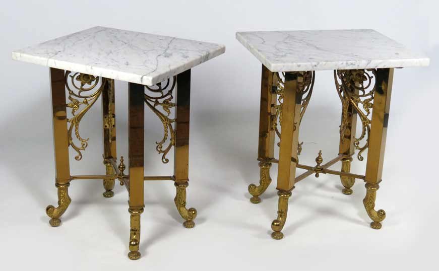 PAIR OF BRASS ART NOUVEAU LOW TABLES: bases fold, 21”h, with white marble tops, 15” by 18” Ex. Kurt Reynolds collection, Boston