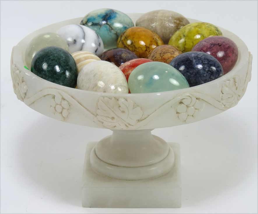(on 16) ALABASTER TAZZA WITH STONE EGGS: white alabaster tazza, 6.5”h; 9.5”diam.; filled with (15) assorted stone eggs Ex. Kurt Reynolds collection, Boston