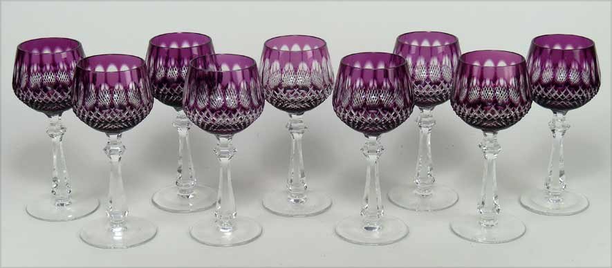 SET OF (9) AMETHYST TO CLEAR-CUT GLASS WINES: tall stems on footed base, 7.5” Ex. Kurt Reynolds collection, Boston