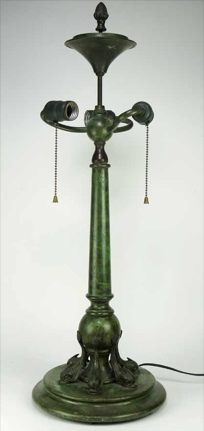 CLASSICAL-STYLE VERDIGRIS TABLE LAMP: c. 1920, 3-light, base with six dolphins supporting ball, 28”h (total) Ex. Kurt Reynolds collection, Boston