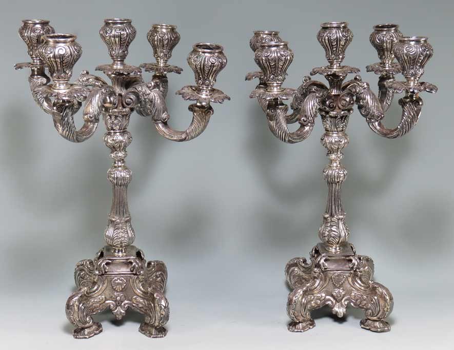PAIR OF SPANISH COLONIAL SILVER CANDELABRUM: 1750-1850, found in Colombia, but poss. Spanish, unmarked 5-light, 13.5”h; 147 troy oz. incl. old wood weight in base Ex the private collection of a Connecticut gentleman and his wife who resided fo