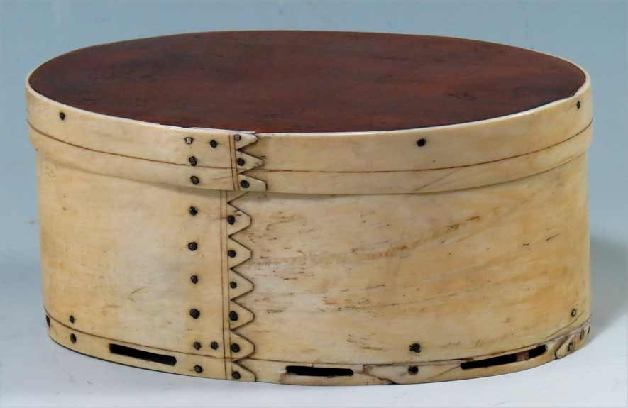 AMERICAN WHALE BONE AND MAHOGANY DITTY BOX: oval-form, steamed pan bone with eight triangular ‘fingers’ to body, three to lid mahogany top and base, old note in ink script inside: Mother Drew, with kind regards and many good wishes 3.75”h
