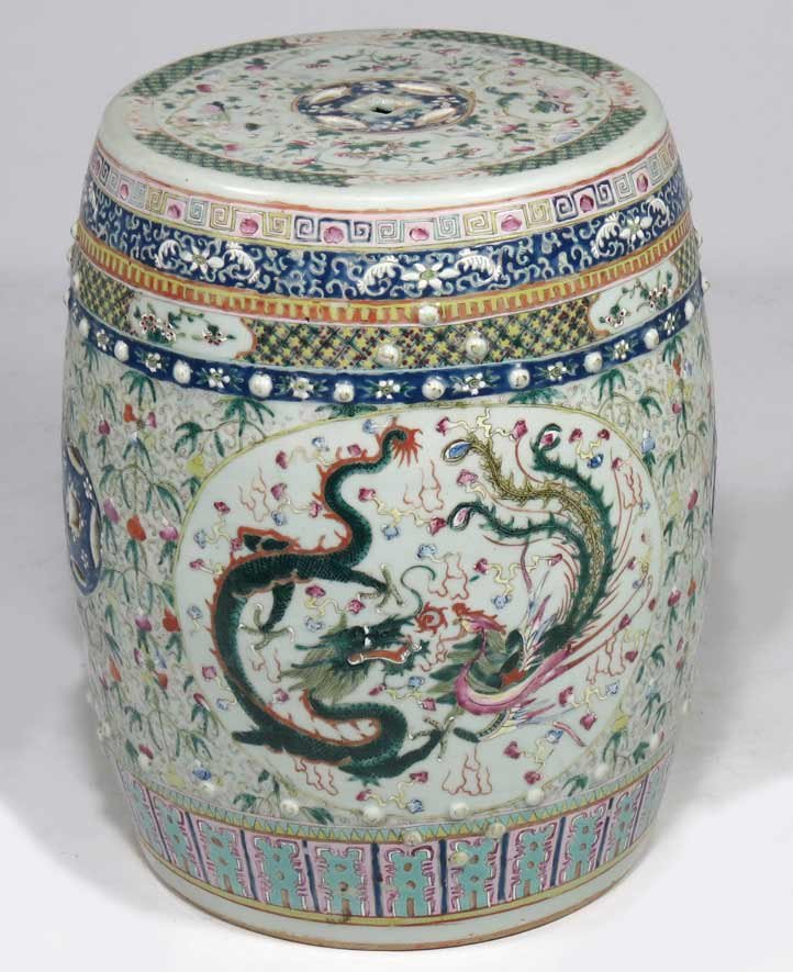 19TH C. CHINESE EXPORT GARDEN BARREL: front and reverse with dragon and phoenix design, overall floral ground, cut-outs to top and sides, 18.5”h; top 12.5”diam.