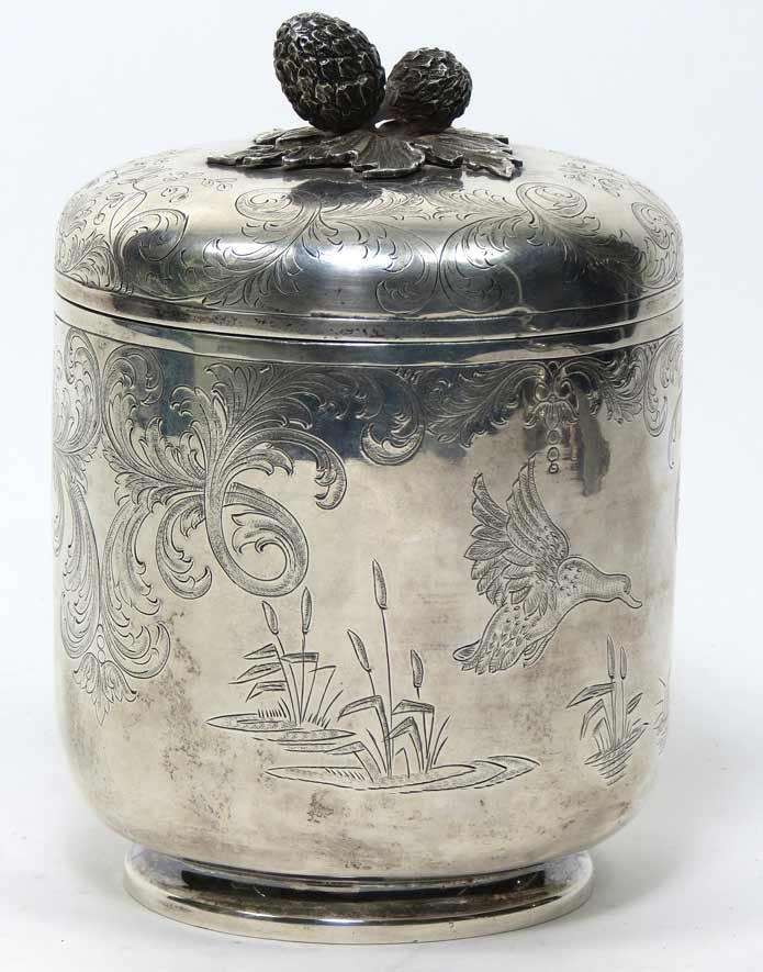 TIFFANY STERLING FOOTED COVERED JAR: marked on bottom: TIFFANY & CO./STERLING/PORTUGAL also inscribed in script: Best Wishes/Randi & Dad/Love/June & Dick/30 July 1973 acorn and oak leaf finial on lift-off lid, etched decoration of duck a