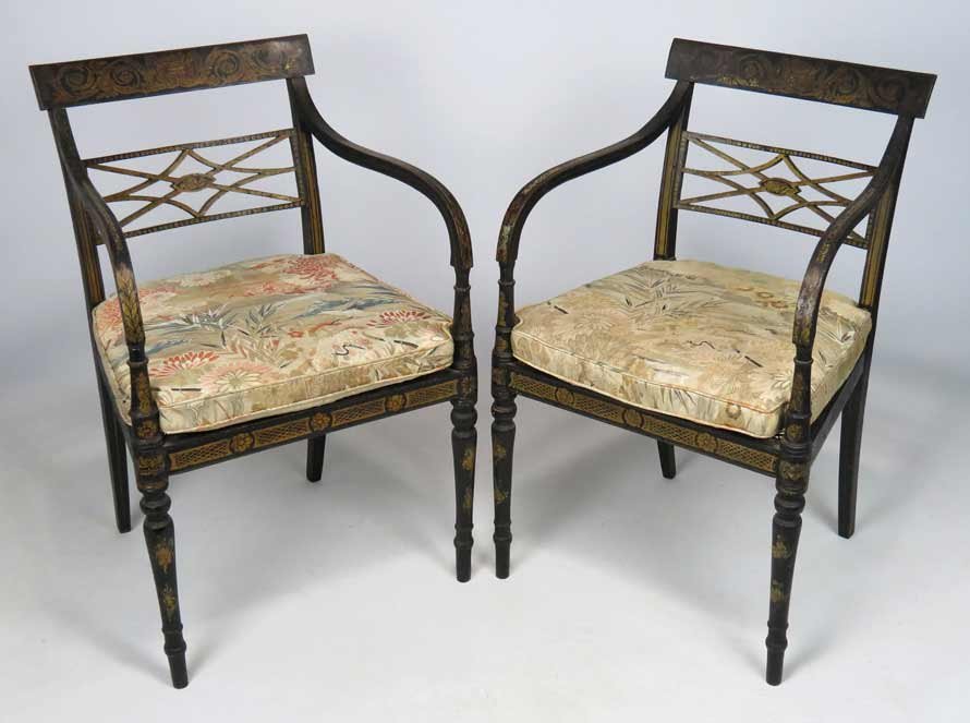PAIR OF ENGLISH REGENCY ARMCHAIRS: c. 1810, original paint and gilding, caned seats with cushions, 33.5”h; 20.5”w