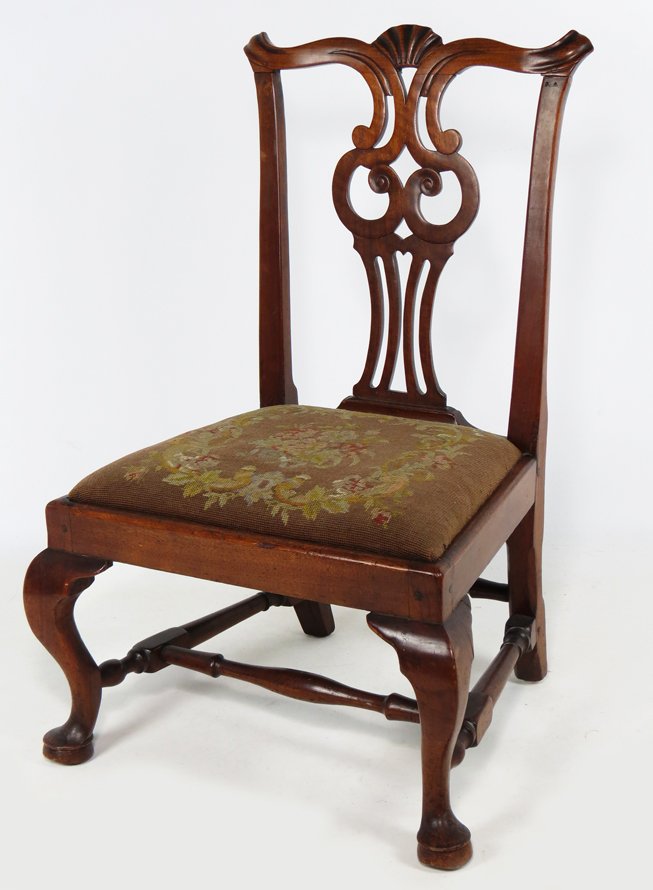 MASSACHUSETTS CHIPPENDALE MAHOGANY SLIPPER CHAIR: old color, shell-carved crest rail, pierced splat, slip seat with needlework upholstery, cabriole legs joined by block and turned stretchers, high pad feet, 34”h; 14”h seat rail; 21”w