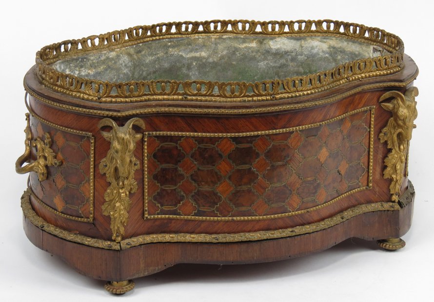 FRENCH MARQUETRY ORMOLU-MOUNTED PLANTER: 19th c., serpentine-form, pierced rim, ormolu ram head mounts and handles, removable lead liner, 8”h; 16”w; 10.5”d
