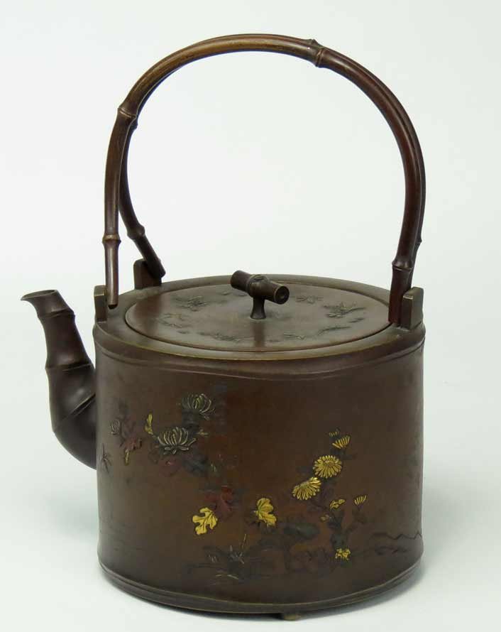 19TH C. JAPANESE MIXED METAL TEAPOT: Meiji period (1868-1912), copper inlaid with gilt leaves and blooms and insect, bamboo-form handle, spout and finial, 7”h (incl. fixed handle); 4.5”diam.