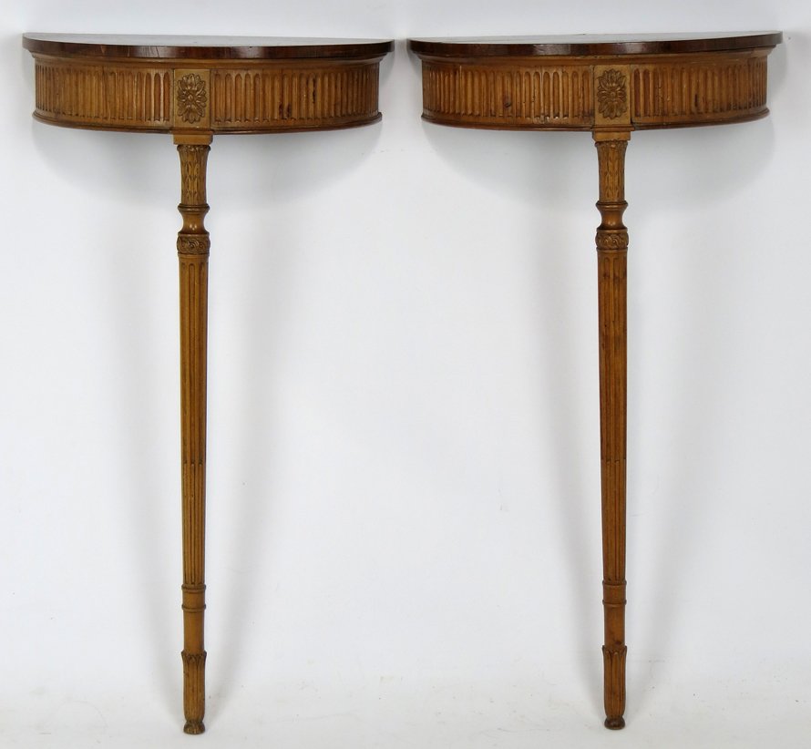 PAIR OF PETITE DEMILUNE CONSOLE TABLES: carved apron, oak with mahogany top, on fluted single leg, 32”h; 18”w; 9:d Purportedly from the home of Jane Austin. From a grand brick townhouse home of a Boston couple.