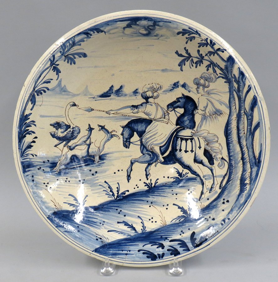 19TH C. ITALIAN BLUE AND WHITE FAIENCE CHARGER: Middle Eastern ostrich hunt, rim signed Tuslia, 15.75”diam.