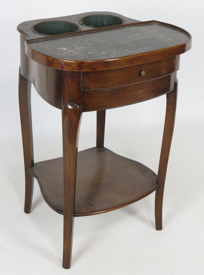 FRENCH LOUIS XV REFRESHOI LIQUOR STAND: shaped top with inset marble and two cut-outs for liquor bottles with removable inset tin liners, drawer to apron, shelf below, 29”h 21”w; 18.5”d