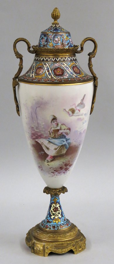SEVRES PORCELAIN AND CHAMPLEVE COVERED URN: the front with hand painted seated lady playing a reed flute with putto above, sgn. R Pelot, 17.5”h