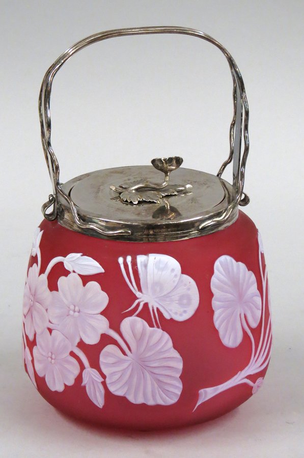 THOMAS WEBB CAMEO GLASS BISCUIT JAR: rose glass with white floral and butterfly decoration, unmarked, silver plated lid with floral finial hallmarked R.F.E.&Co Ltd., 8.5”h incl. fixed handle