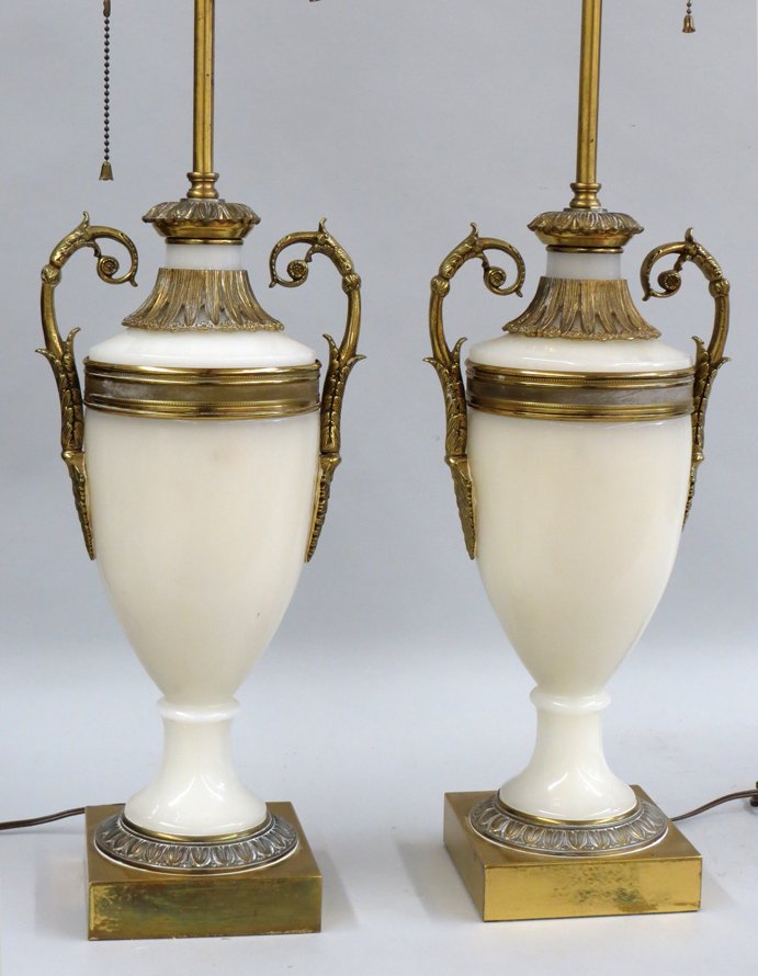PAIR OF OPALINE GLASS URN-FORM LAMPS: bronze mounts and handles, mounted on square brass base, base to top of urn, 17”, adjustable rod From a North Shore, Massachusetts home.