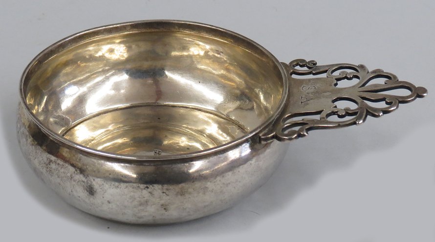18TH C. BOSTON SILVER PORRINGER: mark of Samuel Edwards, Boston (b. 1705-d. 1762) scrolled open handle engraved SA, 5”diam.; 7.6 troy oz.
