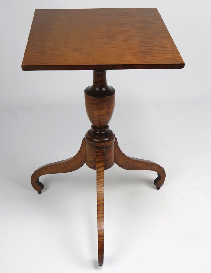 NEW ENGLAND BOLD TIGER MAPLE CANDLESTAND: rectangular top on urn post, in-curving legs with scrolled feet raised on balls, 28”h; top, 21” x 17.25”