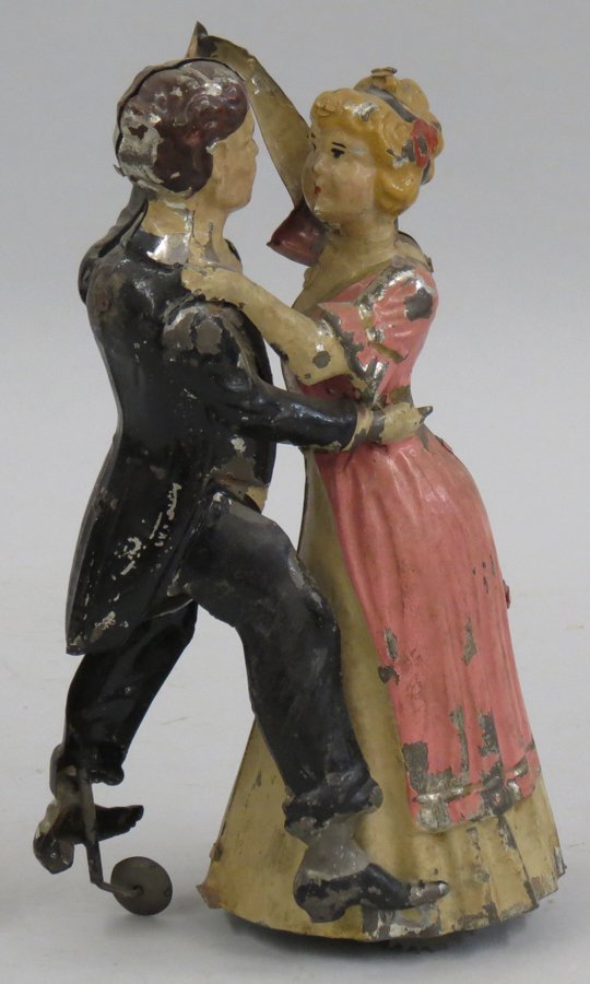 19TH C. BAVARIAN DANCING COUPLE TIN TOY: original paint, wind-up mechanism in working order, 8”h
