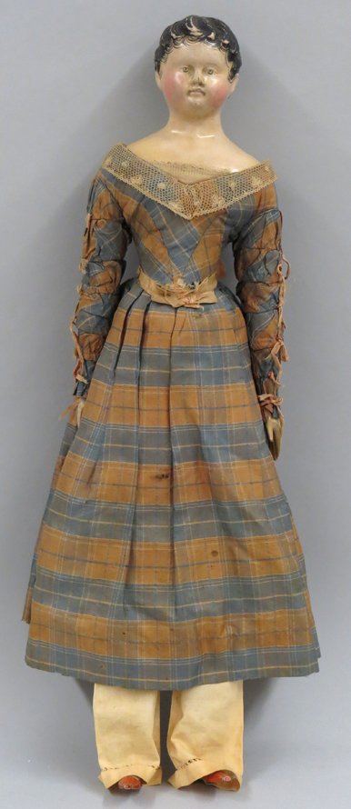 19TH C. DOLL: c. 1830, papier mache head, original dress and undergarments, carved wood arms and legs, 19” The consignor’s mother father collected dolls and toys for many years creating a small museum for the e