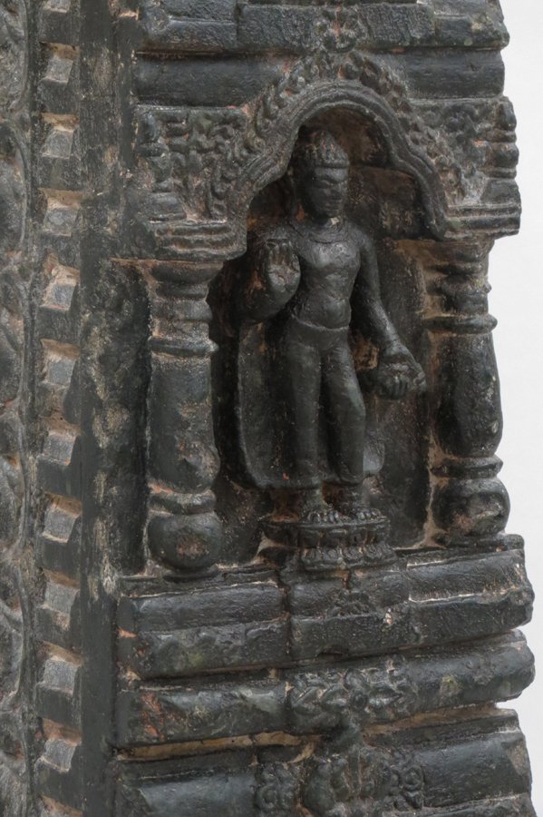 INDIAN CARVED BUDDHIST STONE TOWER: heavy and finely carved dark stone stele depicting three Buddhas, possibly a fragment, 22.5”h label on reverse: Tower of Buddha, pala