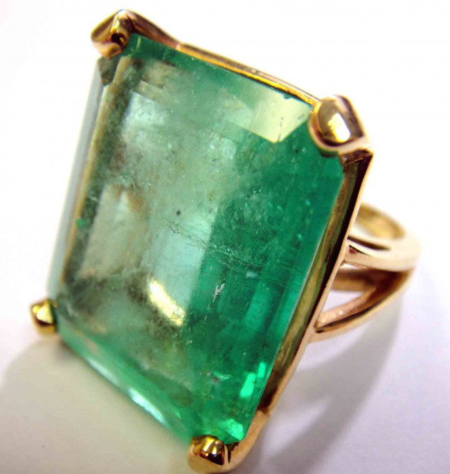 47.03ct Emerald Solitaire 14KT Yellow Gold ladies Ring: Total Weight of Colored Stones: 47.03ct. (Heavy Clarity included) Total Weight of Ring: 20.60 Grams.