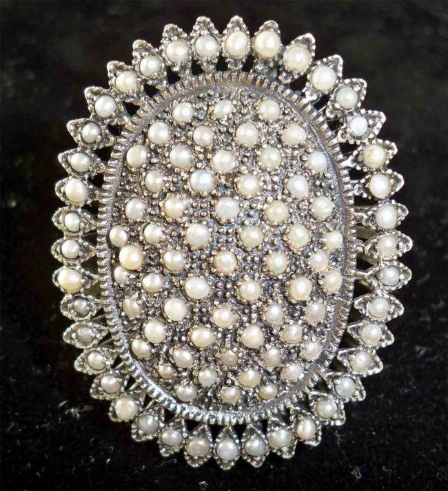 Antique Afghani Silver and White Pearl Ring: Antique Pearl and genuine Silver Ring. Huge ring, over 1.75" inches all the way around. Acquired from same estate aS the previous lot Turquoise ring. From afghanistan Condition Report Antique in excel