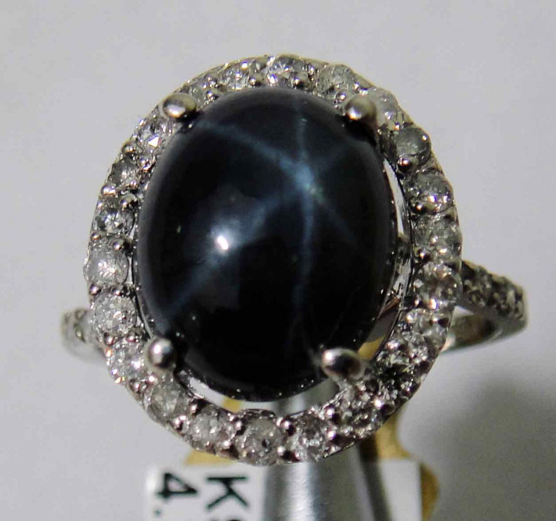 6.50ct Star Sapphire & .59ct Diamond on 14KT Gold Ring: Total weight of Sapphire: 6.50ct ( Clarity: Type II may include eye-visible features, Color: Blue) Total weight of Diamond: 0.59ct (Clarity: I-1, Color: H) Total weight of Item: 4.30 Grams.
