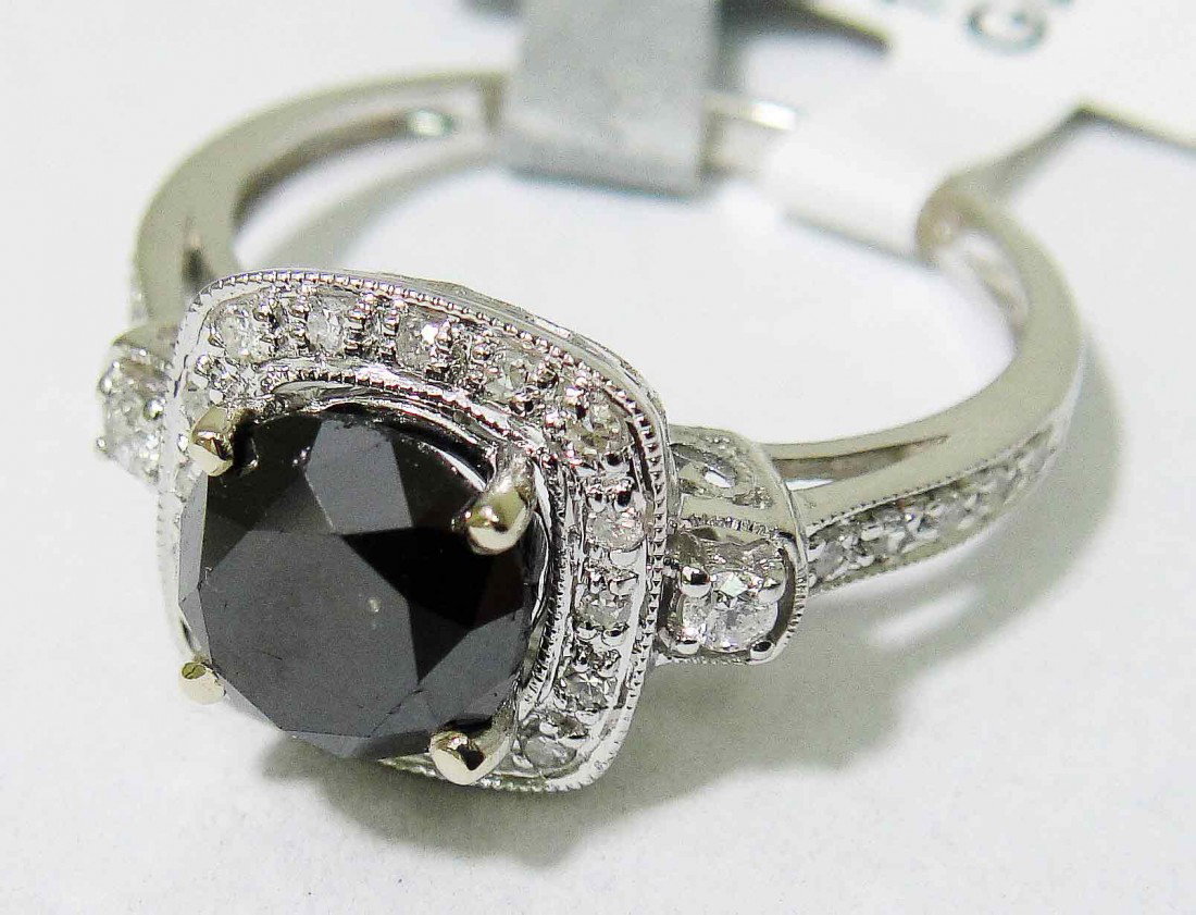1.90ctw Black & White Diamond on 18KT White Gold Ring: Total weight of loose Black Diamond: 1.74ct (Clarity: Opaque, Color: Black) Total weight of Diamond: 0.16ct (Clarity: SI-1 to SI-2, Color: H-I) Total weight of Ring: 3.50 Grams