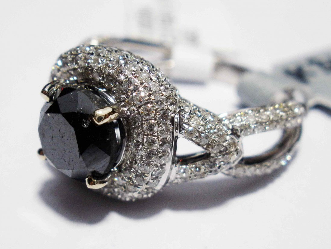 3.01ctw Black & White Diamond 14KT Gold Ladies Ring: Total weight of Black Diamond: 2.01ct (Clarity: Declasse, Color: Fancy Black) Total weight of 295 Diamond's Stones: 1.00ct (Clarity: SI-1 to I-1, color: G-I) Total weight of Ring: 5.60 Grams