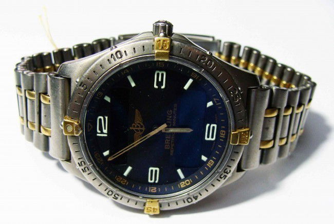 Gents Breitling 18KT Two Tone Aerospace Wristwatch: (Appraised at $4,400.00) One gents, custom cast & hand crafted Breitling Titanium Aerospace wristwatch electronically tested Titanium and 18 KT yellow gold, Case: 41mm, Crown: protective shoulders, Be