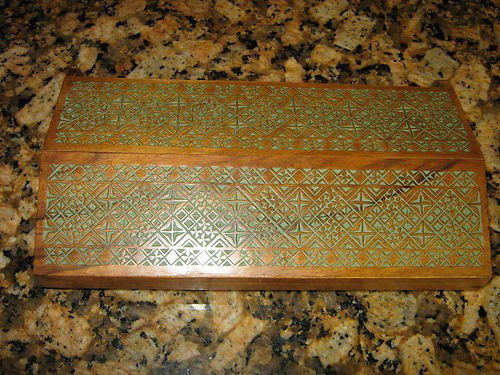 geometric turquoise carved rosewood trinket jewelr: Really beautiful wood grain and carving on this box. It has turquoise paint or stain to make the geometric pattern stand out. 10 1/2" long 2 1/4" tall and 6" wide with hings. This is not put together 