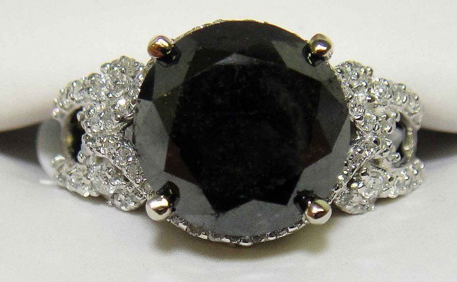 6.56ct Black & 0.46ct White Diamond 14KT Gold Ring: Total weight of Black Diamond: 6.56ct (Clarity: Declasse, Color: Fancy Black) Total weight of Diamonds: .46ct (Clarity: SI-1/I-1, Color: G-I) Total weight of Ring: 6.46 Grams
