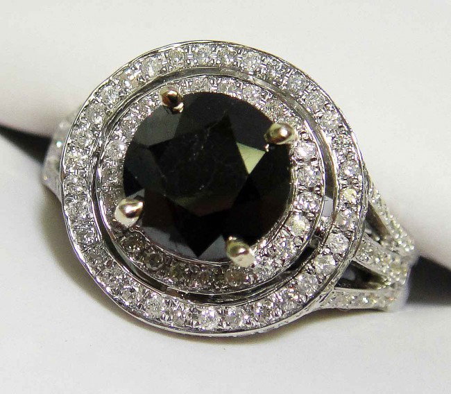 2.02ct Black & 0.78ctw White Diamond 14KT Gold Ri: Total weight of Black Diamond: 2.02ct (Clarity: Declasse, Color: Fancy Black) Total weight of Diamonds: .78ct (Clarity: SI-2/I-1, Color: G-H) Total weight of Ring: 7.52 Grams