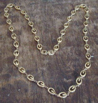 Vtg Signed Long Strand Signature "G" Givency Goldto: a vintage opera length goldtone Givenchy necklace. It has the letter G logo links attached with a small "o" ring in between letter beads. The clasp is signed Givenchy. I found this fabulous item on a 