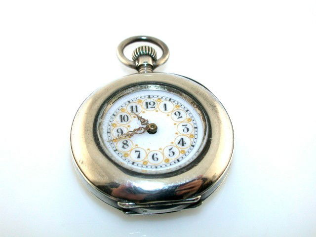 ANTIQUE STERLING SILVER POCKETWATCH: BEAUTIFUL ANTIQUE STERLING SILVER POCKETWATCH WITH AN ENAMEL FACE. THE FACE, CASE, AND CRYSTAL ARE ALL IN VERY NICE SHAPE. THE WATCH WINDS BUT DOES NOT SEEM TO WANT TO RUN, I BELIEVE IT NEEDS OIL. REC
