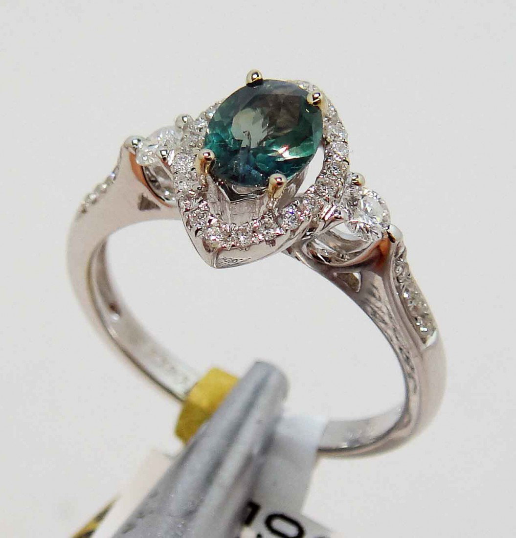 0.53ct Alexandrite & 0.28ct Diamond 18KT Gold Ring: Please review the attached gemologist report for further relevant information.