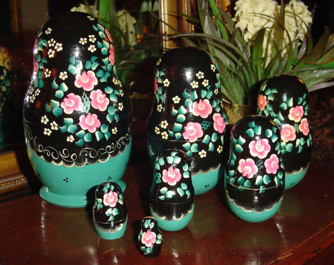 Beautifully Hand Painted and Signed 7 Piece Matryos: Absolutely Gorgeous 7 Piece Set of Matryoshka Russian Nesting Dolls. Beautifully Hand Painted and Signed on the Bottom. The Colors are incredibly Striking and the Artistry is Wonderful to Behold.