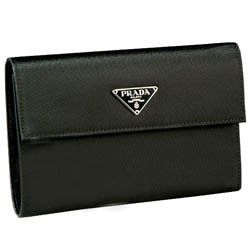 Genuine Prada Milano Black Nylon Tessuto Wallet: Spending or just accessorizing becomes a luxurious pleasure with this sleek and sophisticated, classic Prada wallet. Color: Black; Classic Prada woven tessuto nylon; Snap closure with signature insign