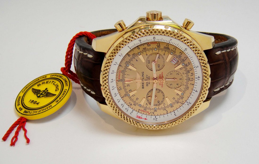 Breitling Bentley Motors Chronograph 18KT Gold Watch: Automatic Breitling 100mm Bentley Motors Chronograph 18KT Gold Gents Wristwatch with brown exotic strap and Breitling 18kt yellow gold tang buckle H25362. Limited Edition of 5/50, in Mint Condition wi