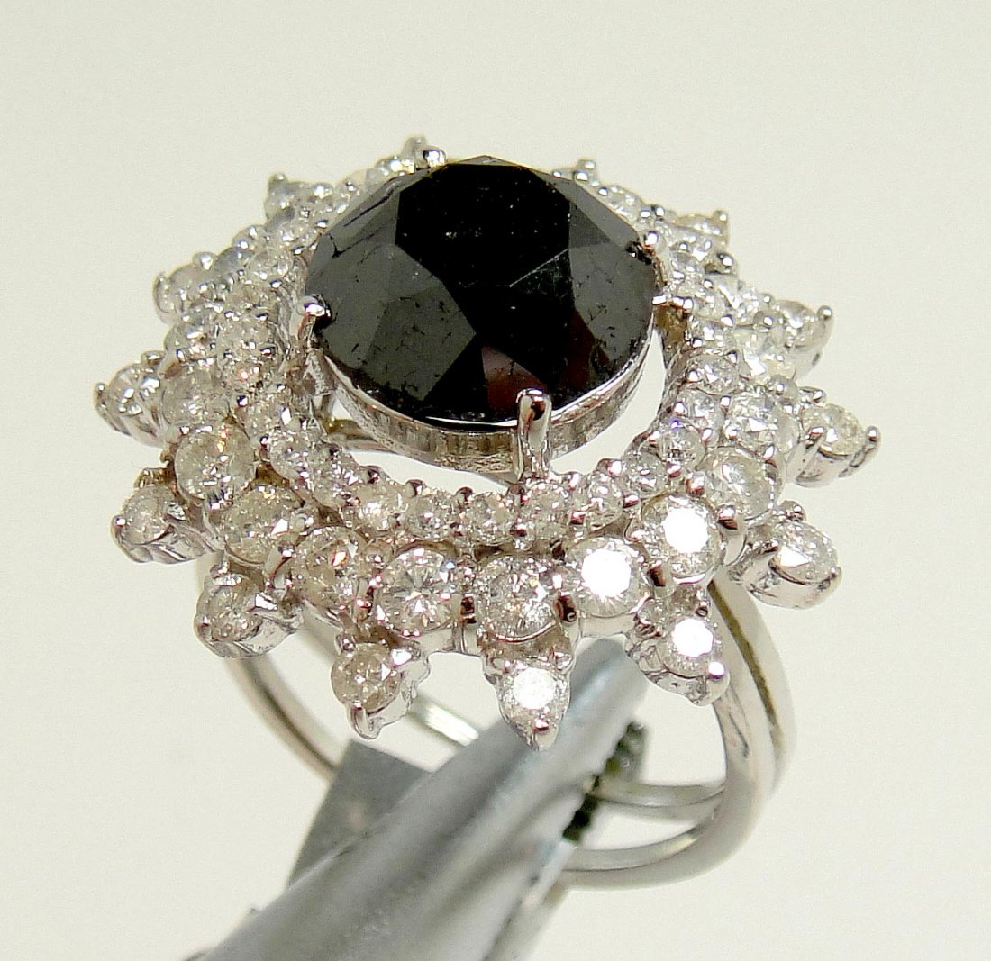 2.87ctw Black/ White Diamond 14KT White Gold Ring: Please review the attached gemologist report for further relevant information.